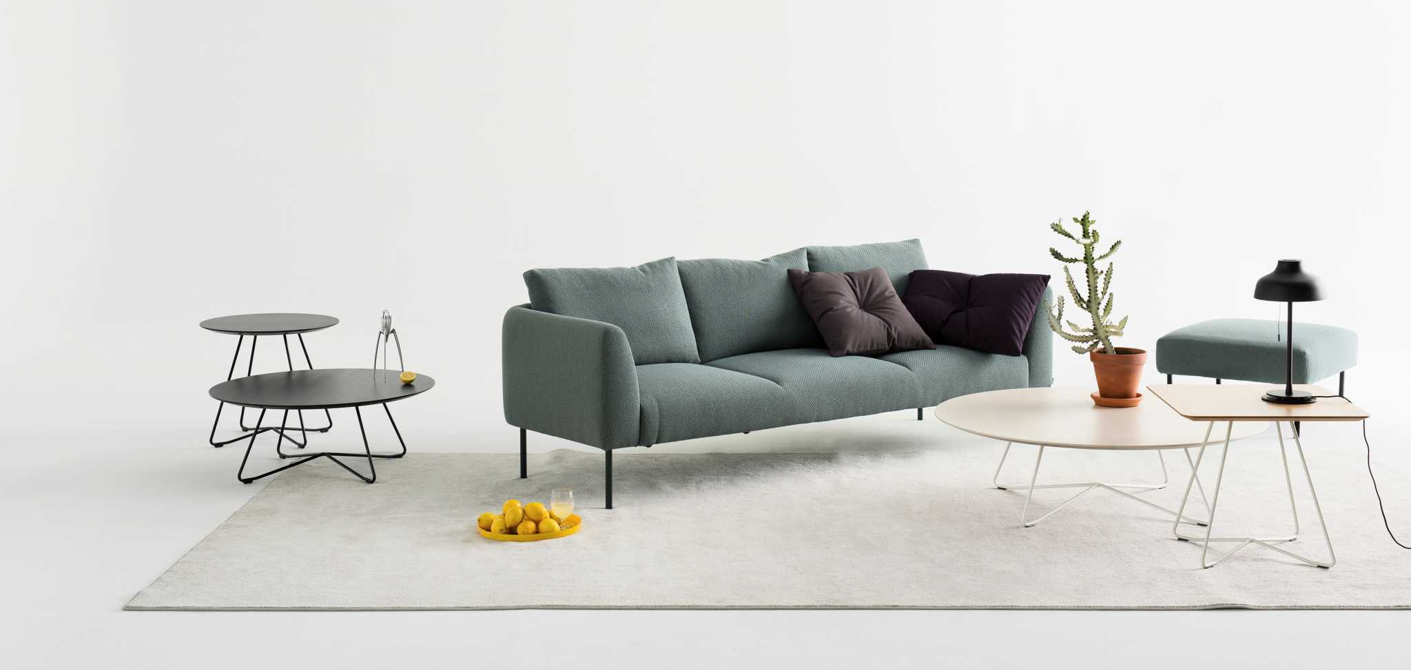 Large grey sofa with a sofa table