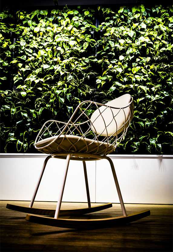 Chair and green wall at Enfo's office in Espoo, Finland