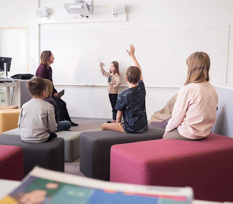 Pupils and teacher in Hiltulanlahti School