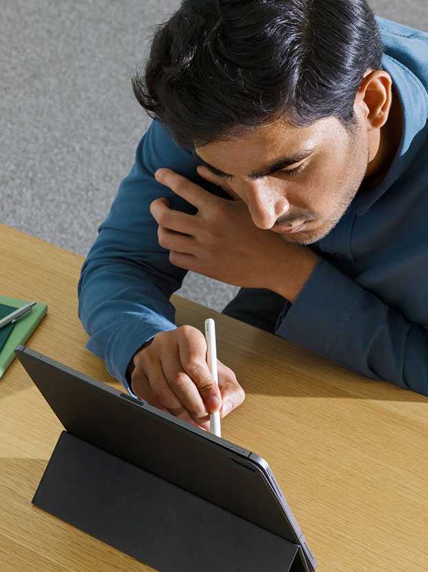 Man working on a tab