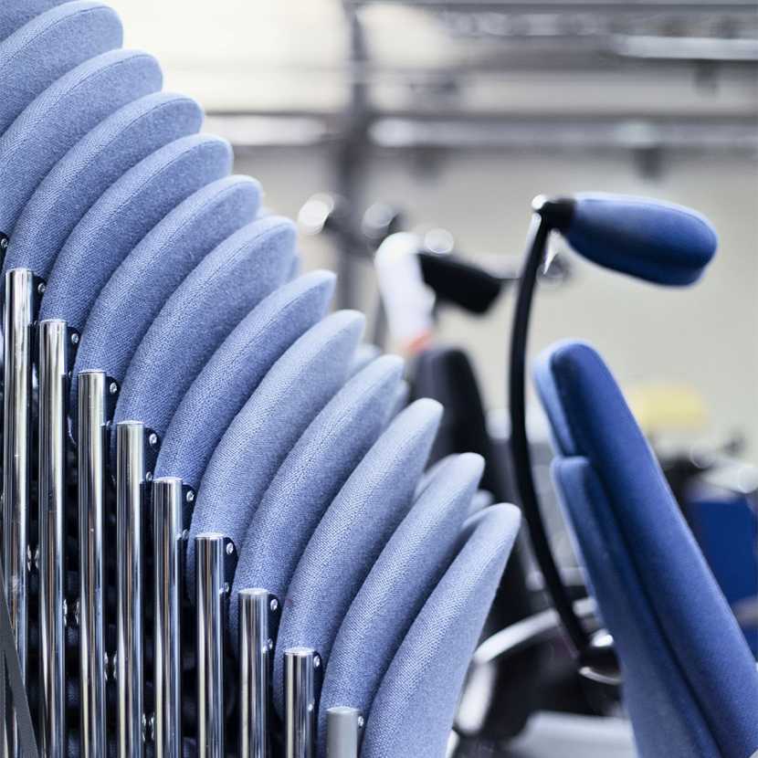 Blue chairs in a stack