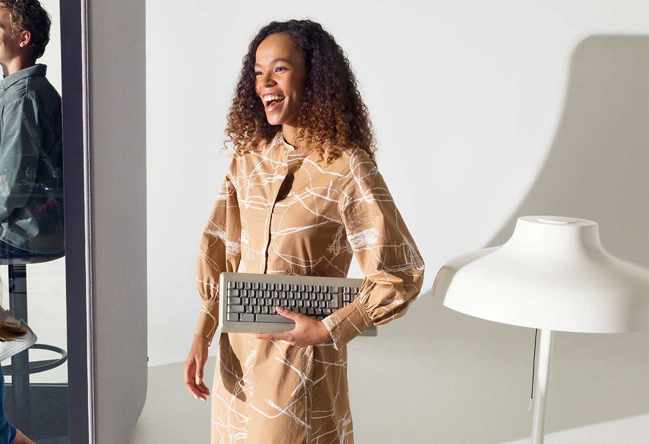 A woman carrying a keyboard