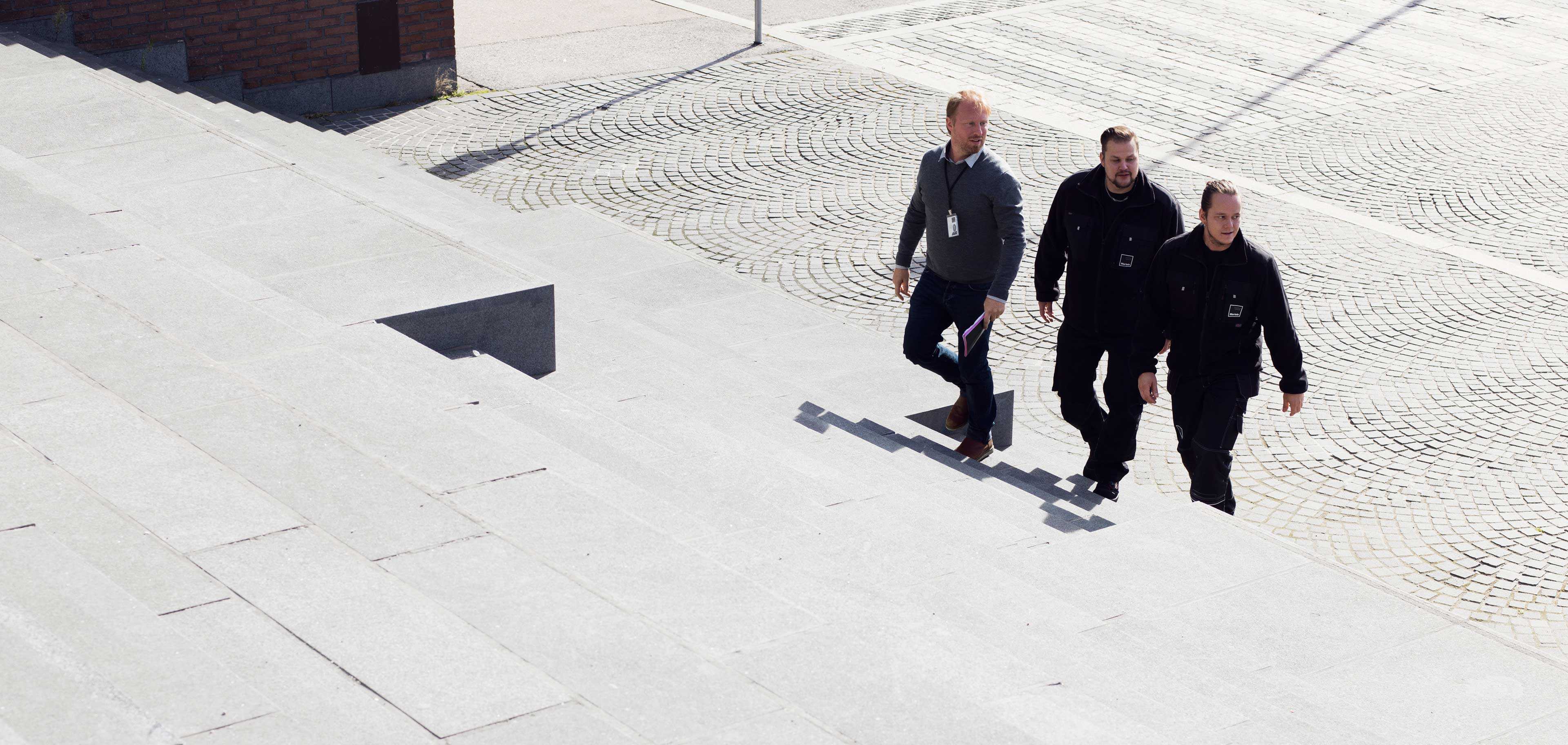 Moving men walking up the stairs