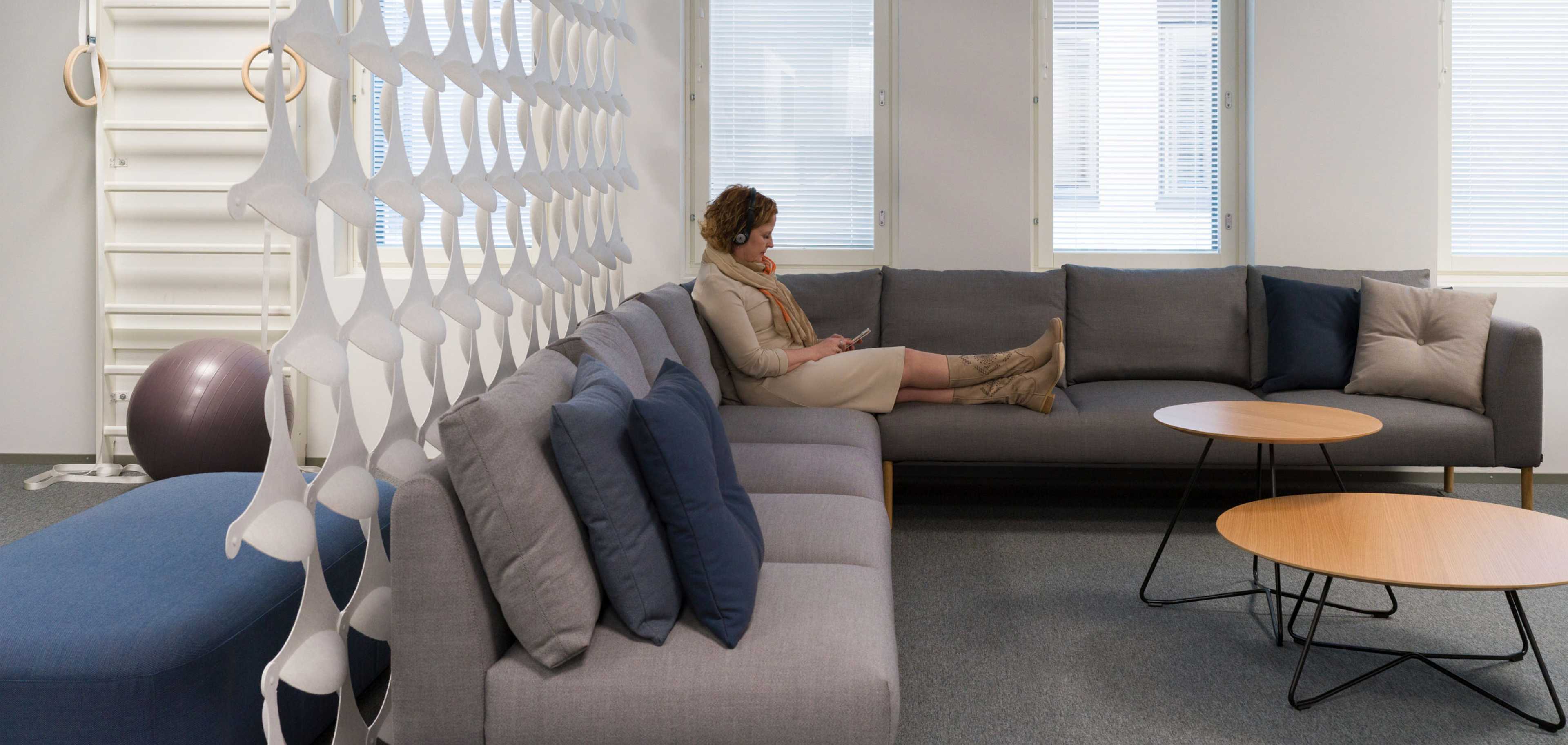 Woman sitting casually on a sofa