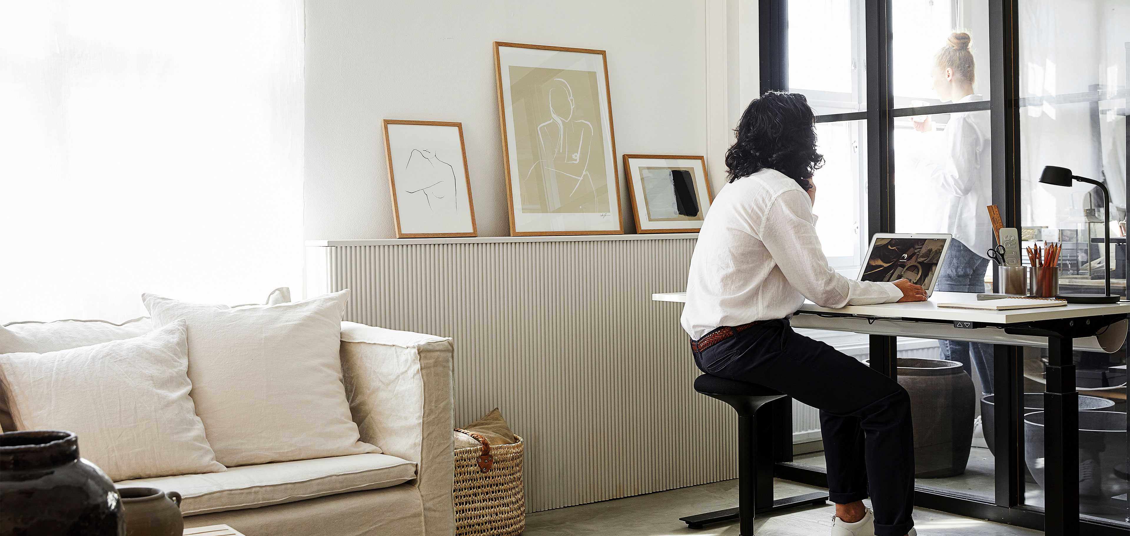 A man at a desk in a home office