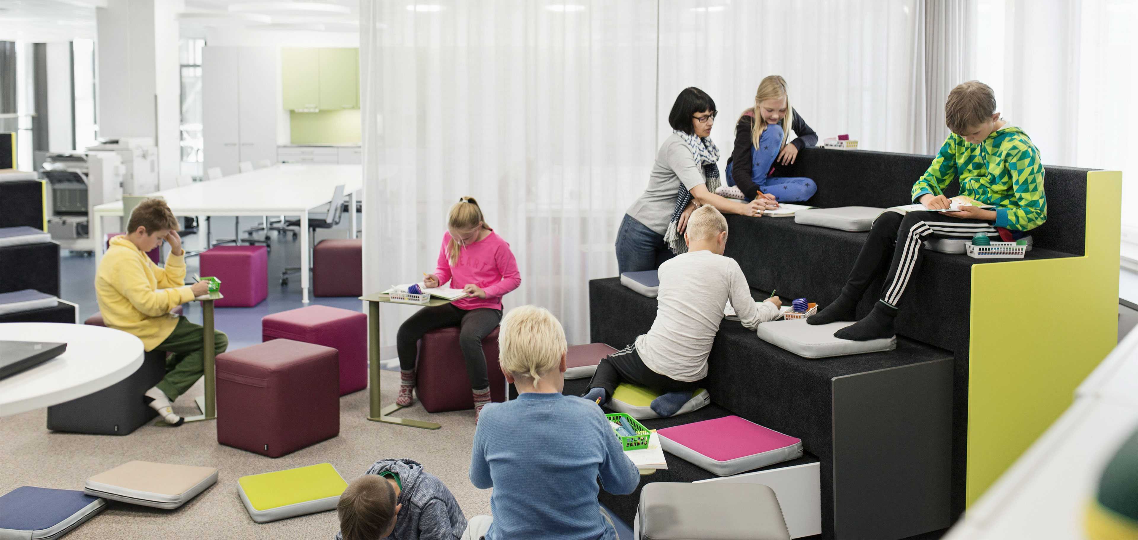 Pupils studying at Martela's Beatbox, Bit stools and Trailer tables at Juteinikeskus School in Hattula, Finland