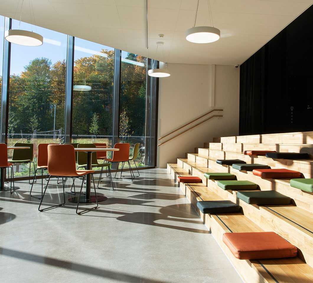 Martela's Sola chairs, Spot tables and Puffet seat cushions at Syvälahti Community Centre in Turku, Finland