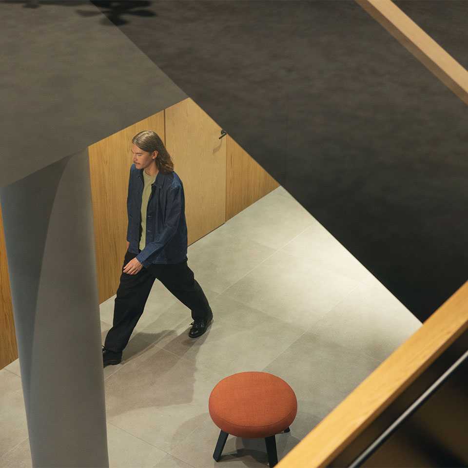 A man walking in the hallway downstairs