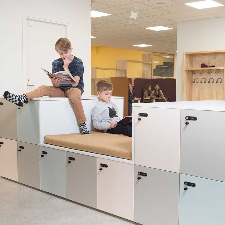 Two boys reading books