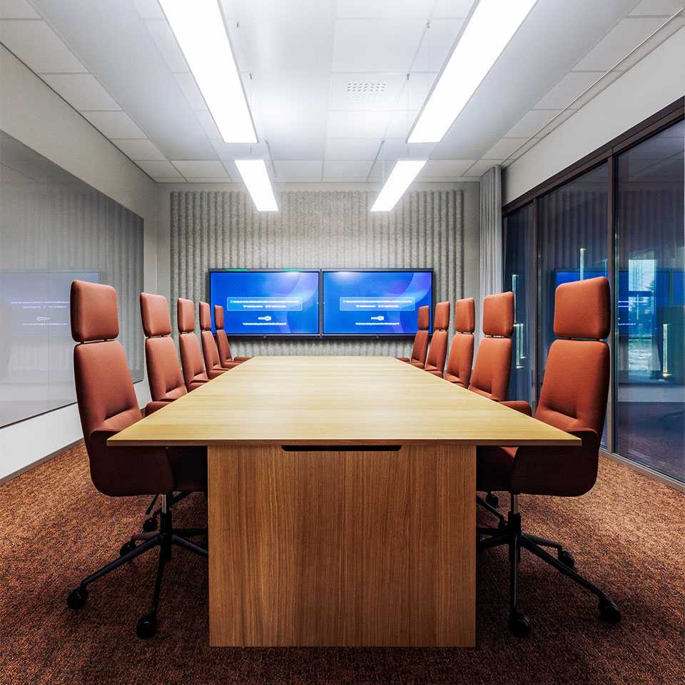 A long conference table and conference chairs